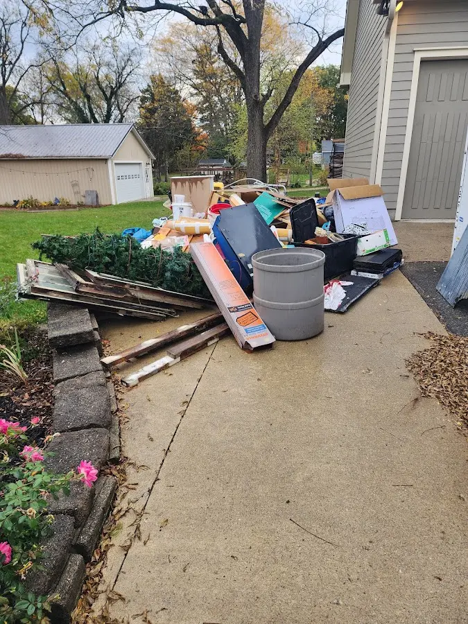 Dumpster being loaded with debris for 3 Yard Dumpster Rental in Desert Aire